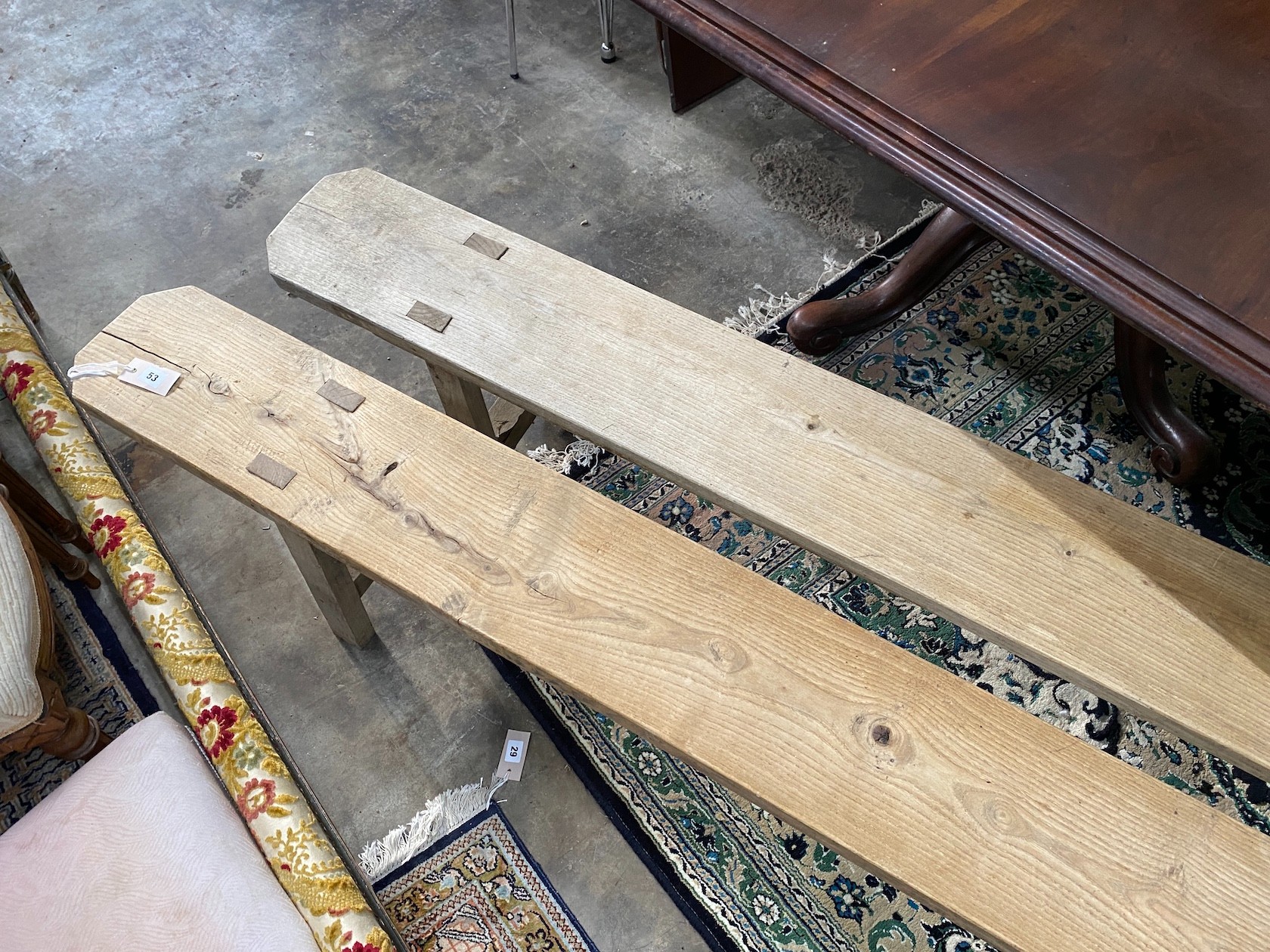 A pair of 19th century provincial elm benches, length 260cm, width 21cm, height 44cm